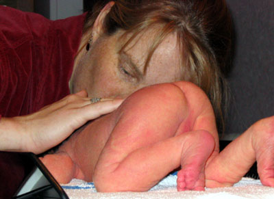 malcolm_getting_weighed_mom.jpg